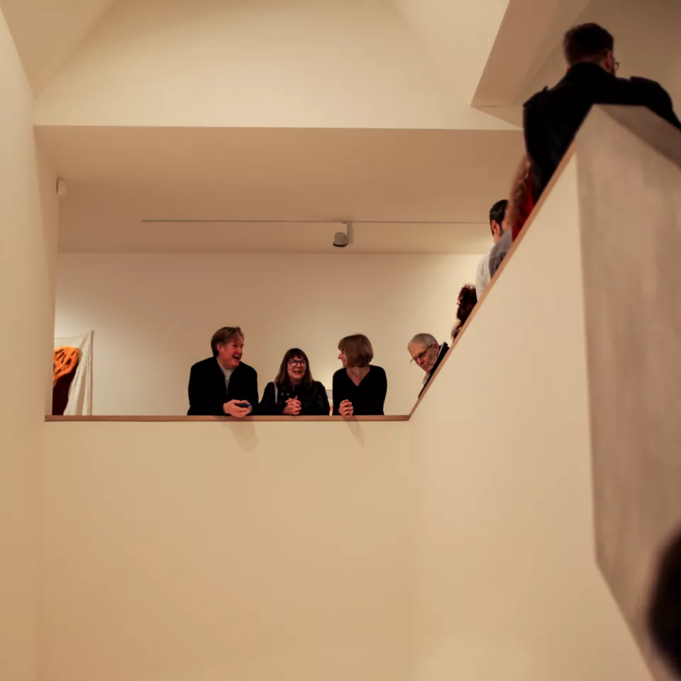 Visitors to an exhibition opening in the gallery